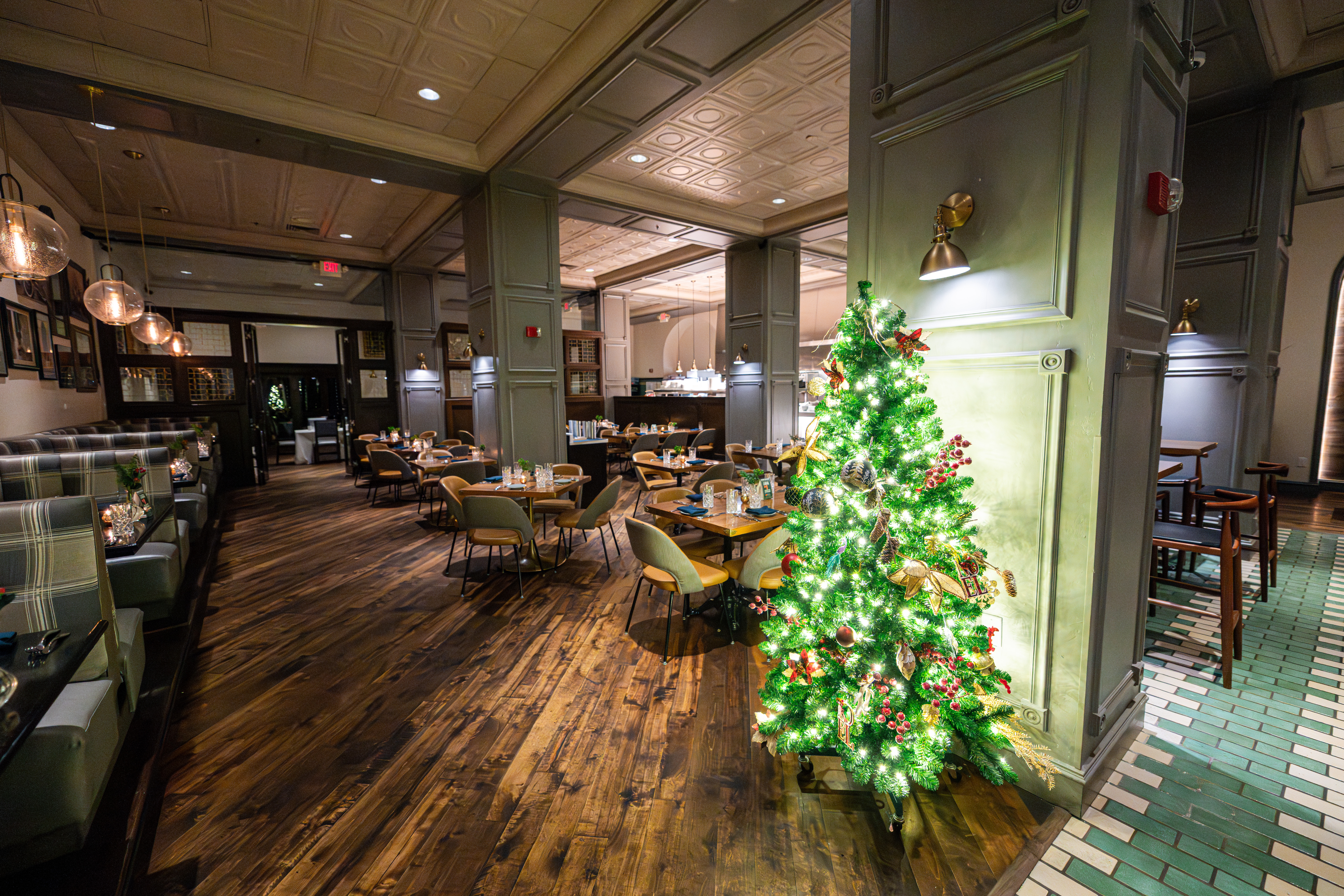 The preston during the holidays with a christmas tree in the restaurant